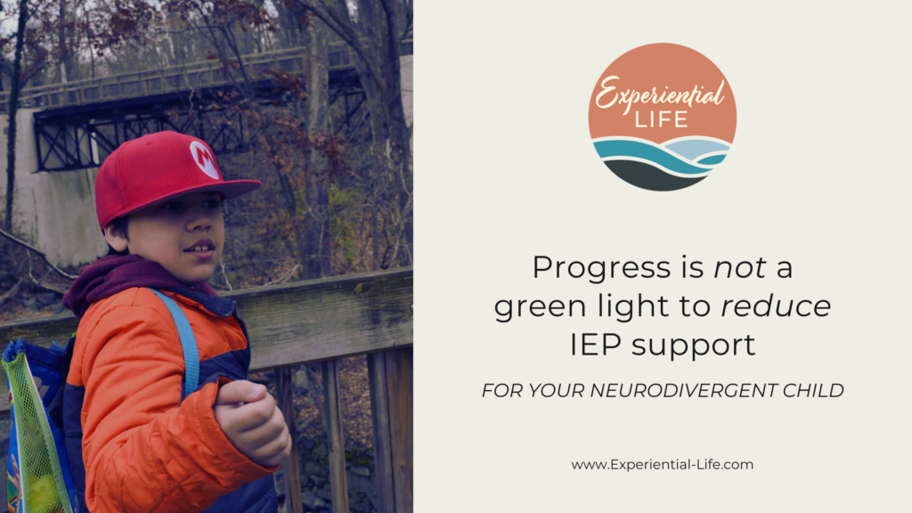 An autistic 10 year old stands outside with red Mario hat, orange coat, and Toy Story Backpack. He is surrounded by a wooden path and trees with no leaves. The text reads: Progress is not a green light to reduce IEP support for your neurodivergent child.